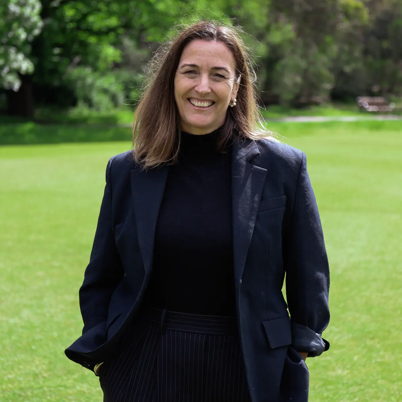 Georgie Thorn hands in pockets smiling